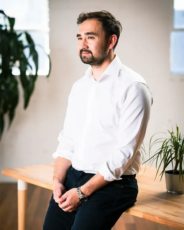 Curtis Clarke seated in a bright office